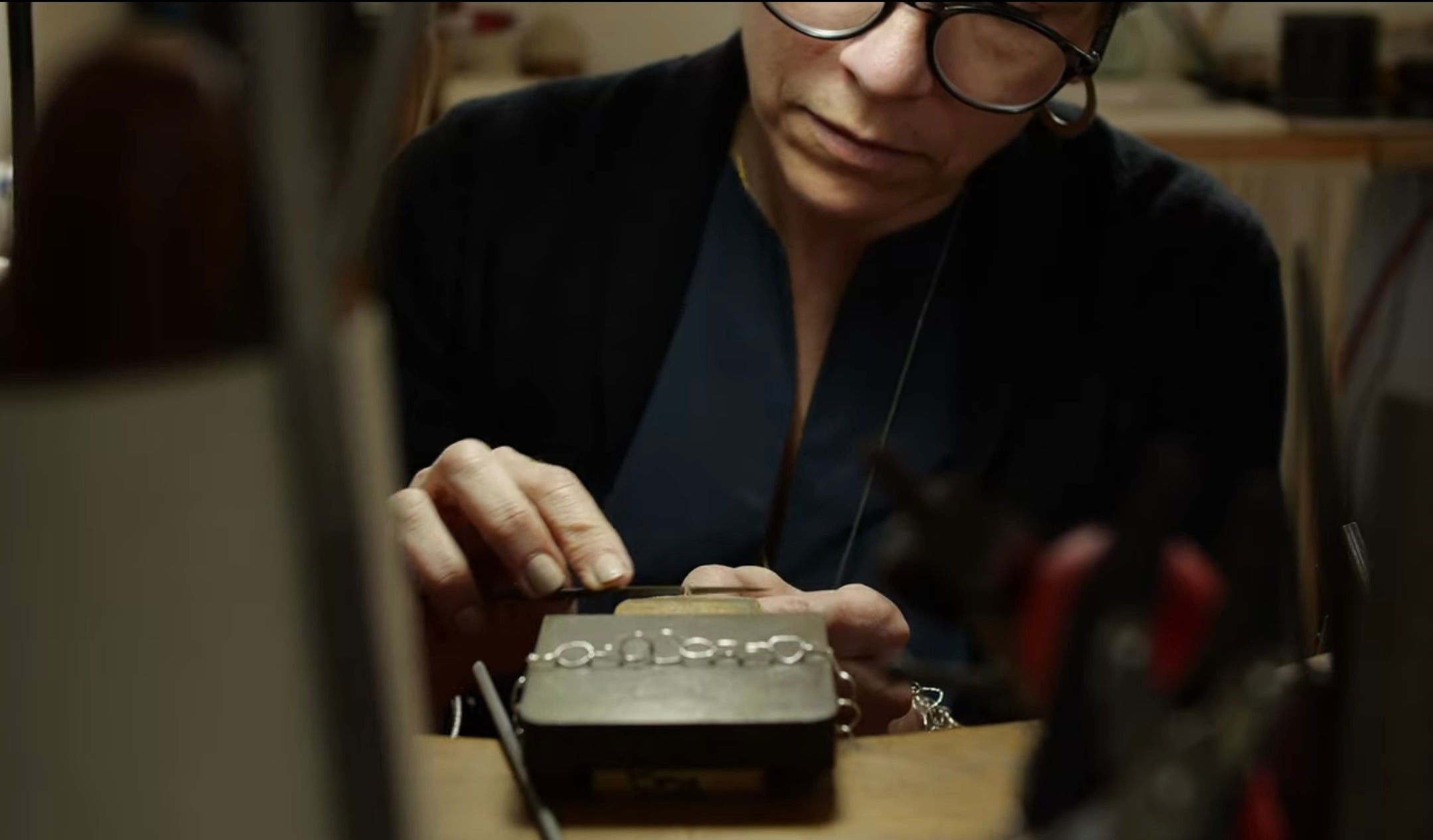 Load video: Crafting beauty with patience:watch the mercerising slow build video of Bea Jareno creating one of her signature necklace from the Afiok Collection