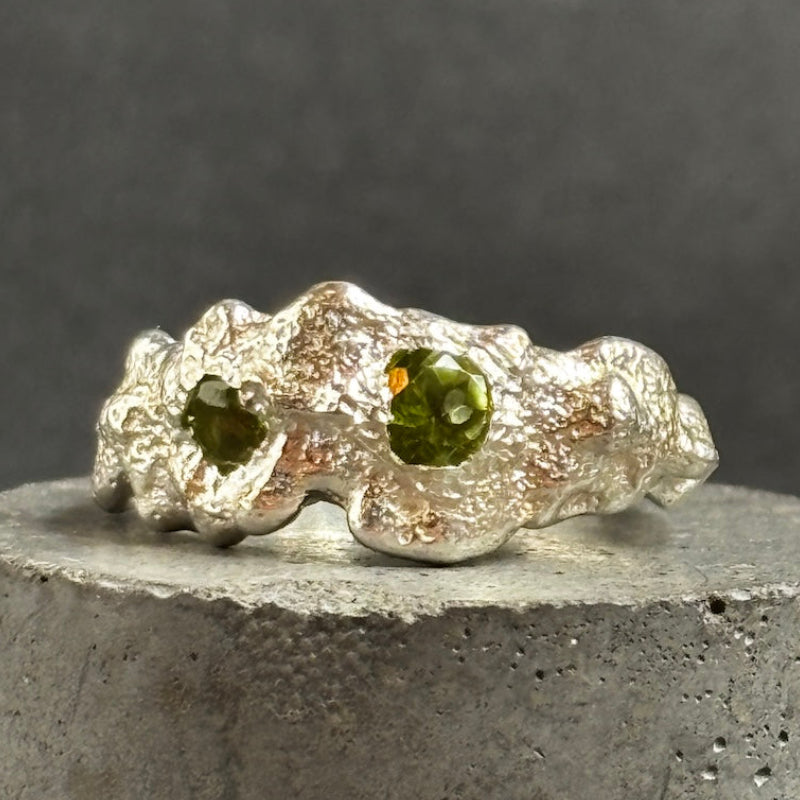 recycled steering silver ring with two peridot gemstones