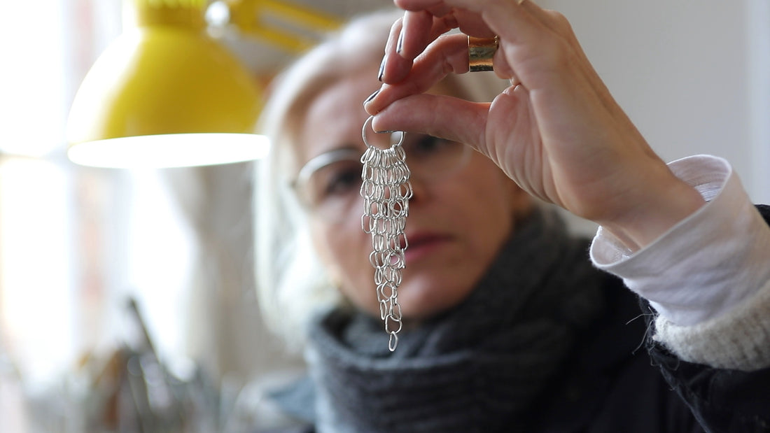 Bea Jareno Jewellery at her London studio looking at a pair of cascade earrings making